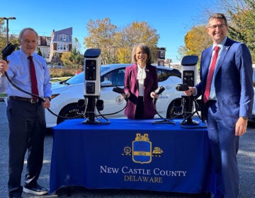 Tom Carper, Lisa Blunt Rochester, and Matt Maher with the new EV plugs.