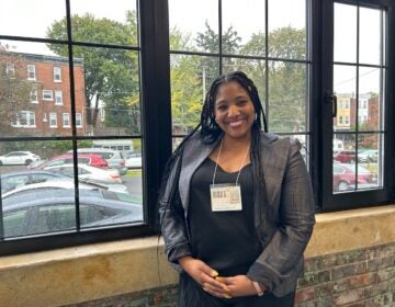 LaKeysha Jean poses for a photo at a window