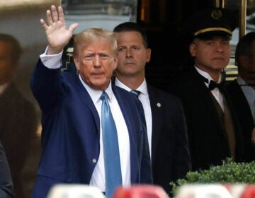 Donald Trump waving to the crowd.