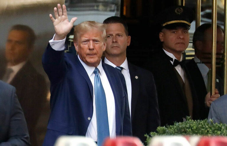 Donald Trump waving to the crowd.