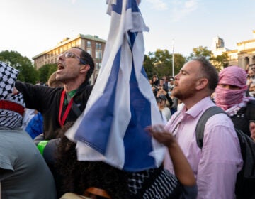 Protesters waving an Israeli flag