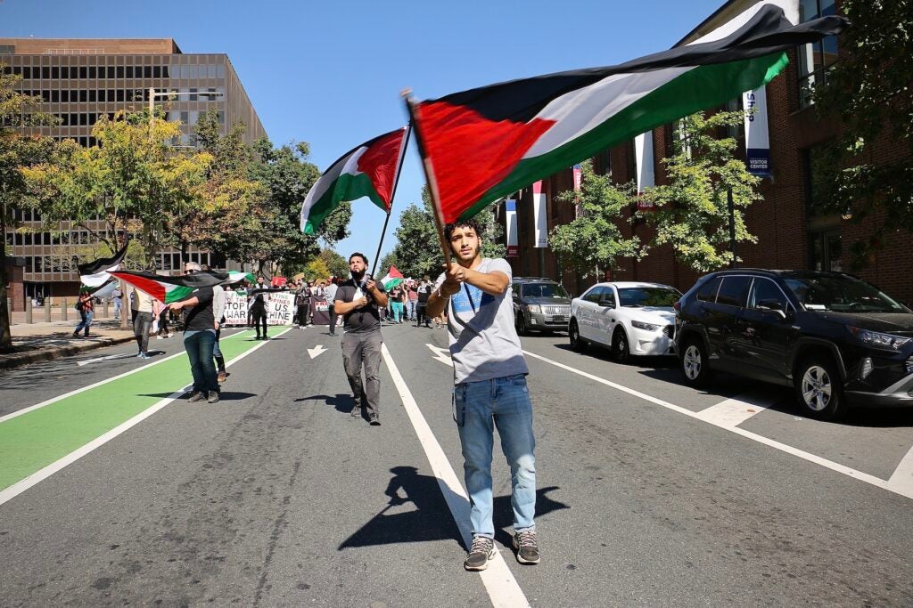 Protester waving a Palestinian flag during the march