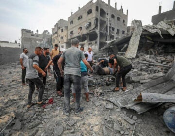 Palestinians evacuate the wounded following an Israeli aerial bombing on Jabaliya, near Gaza City, Wednesday, Oct.11, 2023