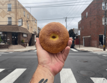 Philip Korshak holds up a bagel in one of his signature social media posts. The shop was the only independent cafe in Philly so far working under a ratified Local 80 union contract