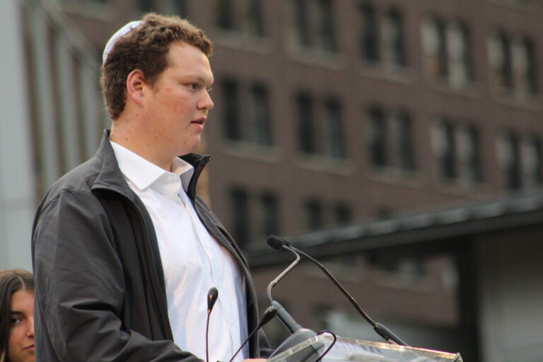 Jacob Weiner speaking at a podium