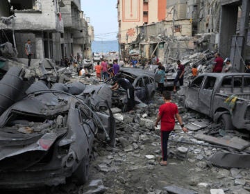 Palestinians inspect the rubble of the West mosque destroyed after it was hit by an Israeli airstrike at Shati refugee camp in Gaza City, early Monday, Oct. 9, 2023.