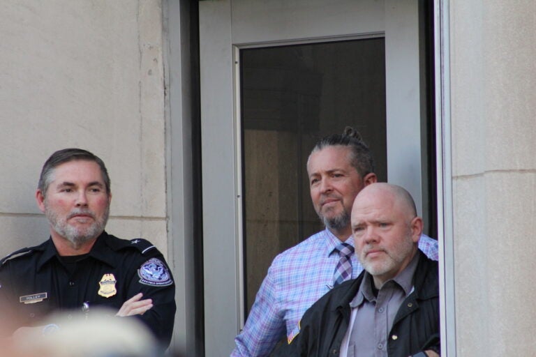 Security guards watching the protest.