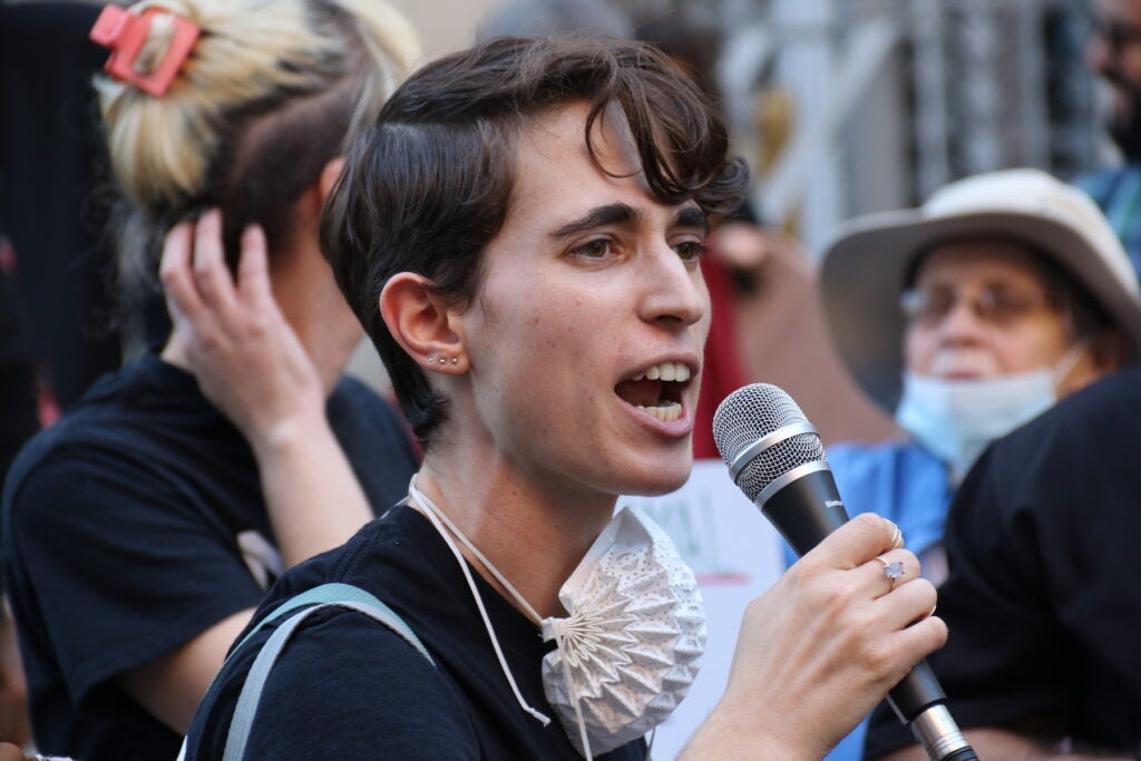 A person speaking into a megaphone