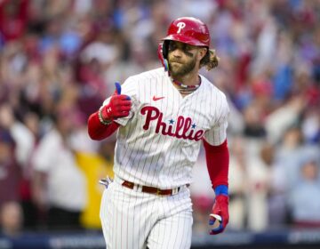 Philadelphia Phillies' Bryce Harper reacts after hitting a three run home run during the third inning of Game 3 of a baseball NL Division Series against the Atlanta Braves Wednesday, Oct. 11, 2023, in Philadelphia. (AP Photo/Matt Slocum)