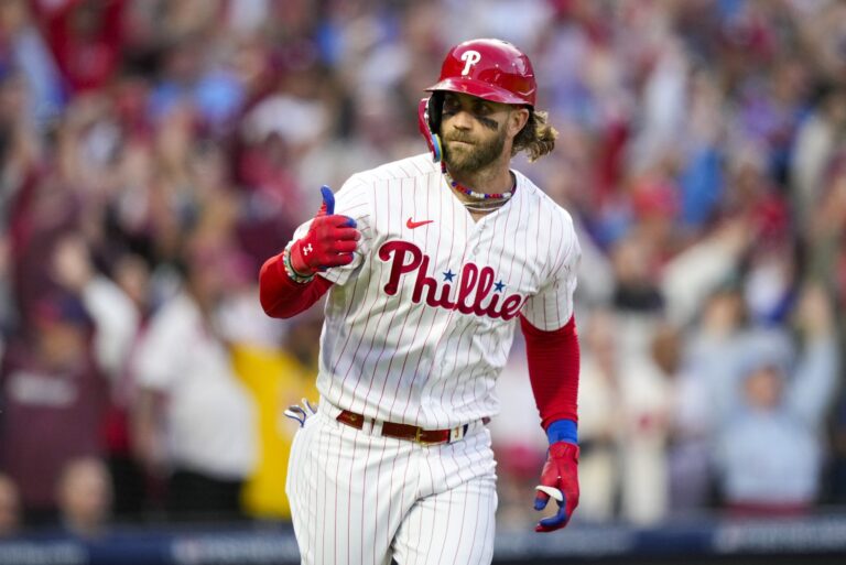 Philadelphia Phillies' Bryce Harper reacts after hitting a three run home run during the third inning of Game 3 of a baseball NL Division Series against the Atlanta Braves Wednesday, Oct. 11, 2023, in Philadelphia. (AP Photo/Matt Slocum)