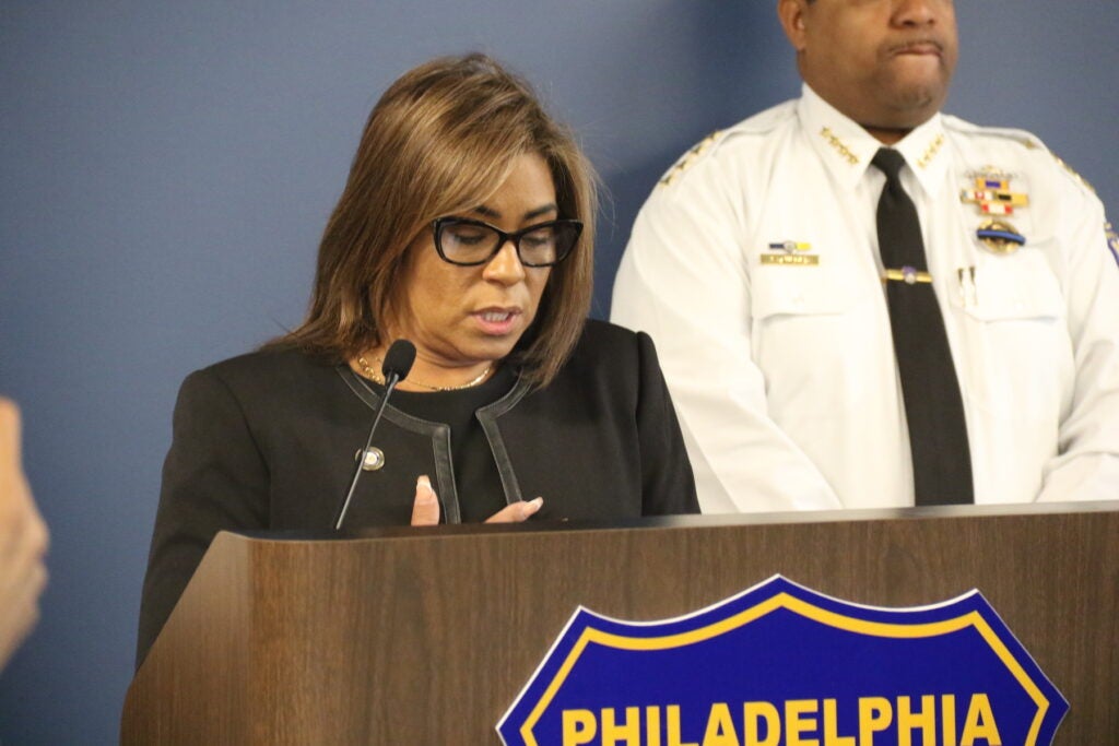 Quetcy Lozada speaking at a podium