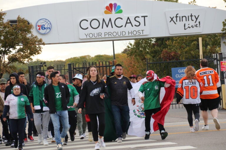 Fans wearing Flyers jerseys, Eagles, and Mexico soccer gear