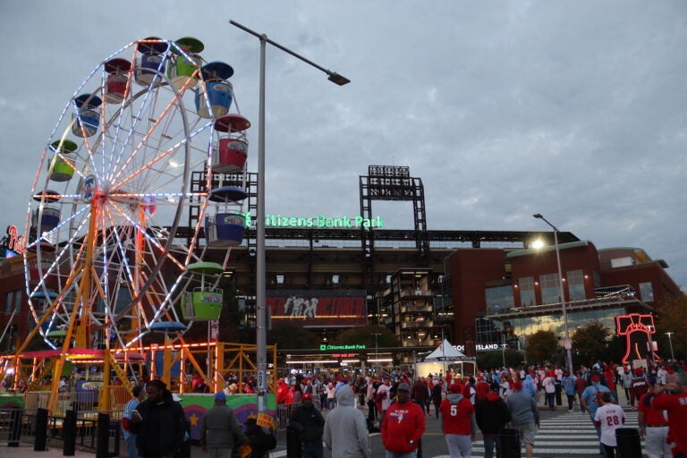 A ferris wheel and streams of fans visible outside of Citizens Bank Park