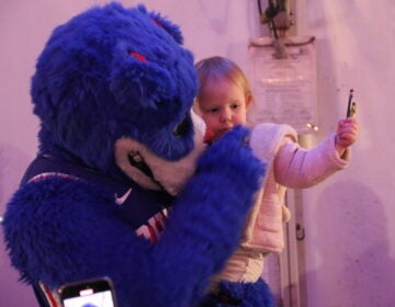 The Philadelphia 76ers and Toyota served a Thanksgiving dinner to military service members and veterans onboard the Battleship New Jersey on Monday night in Camden, New Jersey. (Cory Sharber/WHYY)