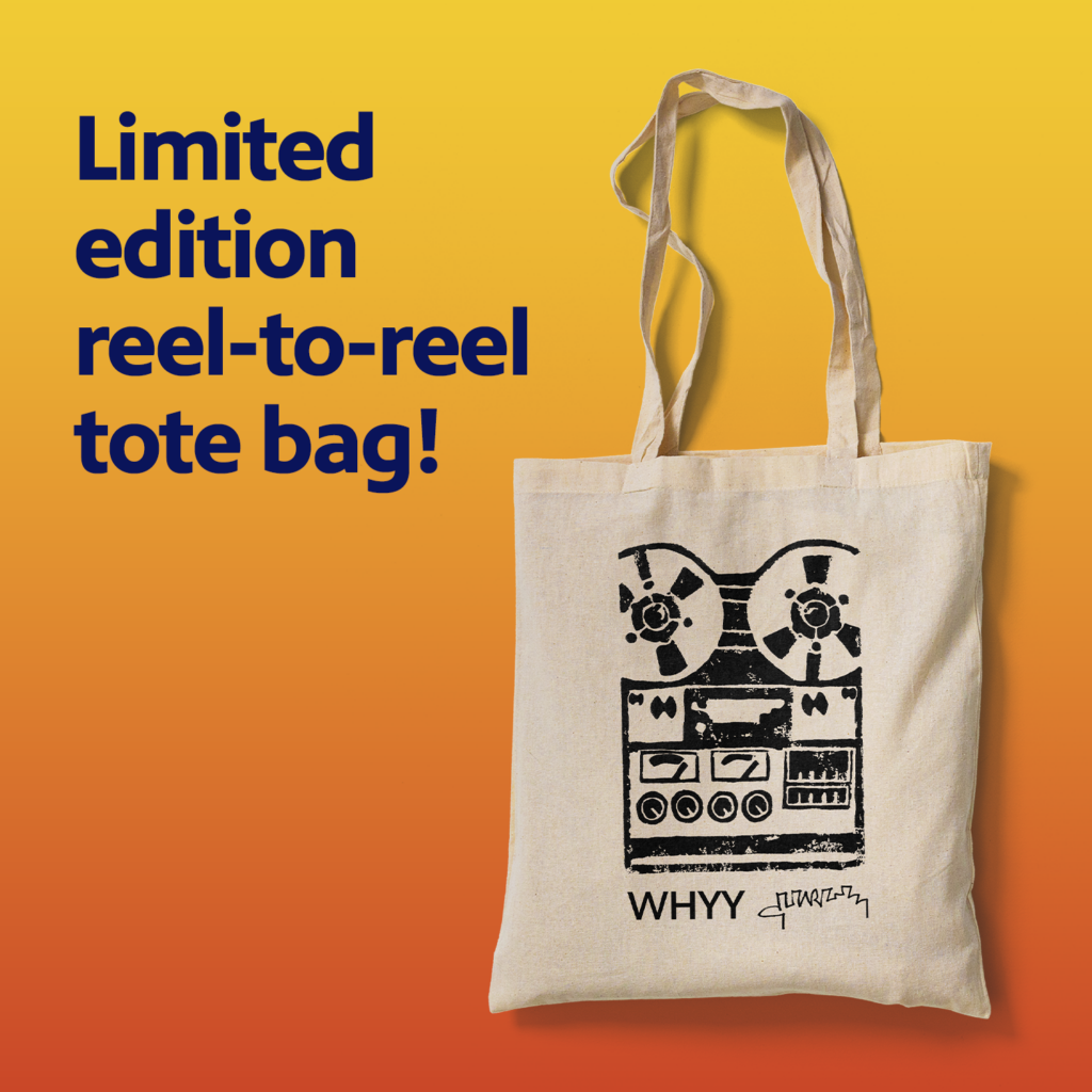 A tote bag with a block print of reel-to-reel tape deck