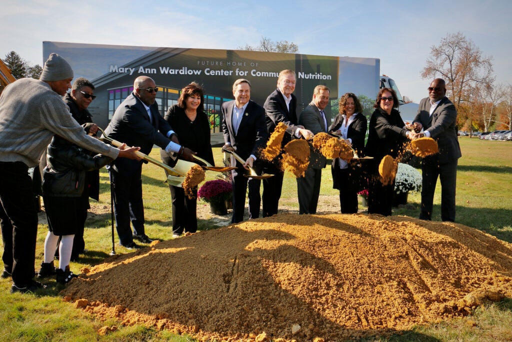 Officials posing with shovels at the groundbreaking