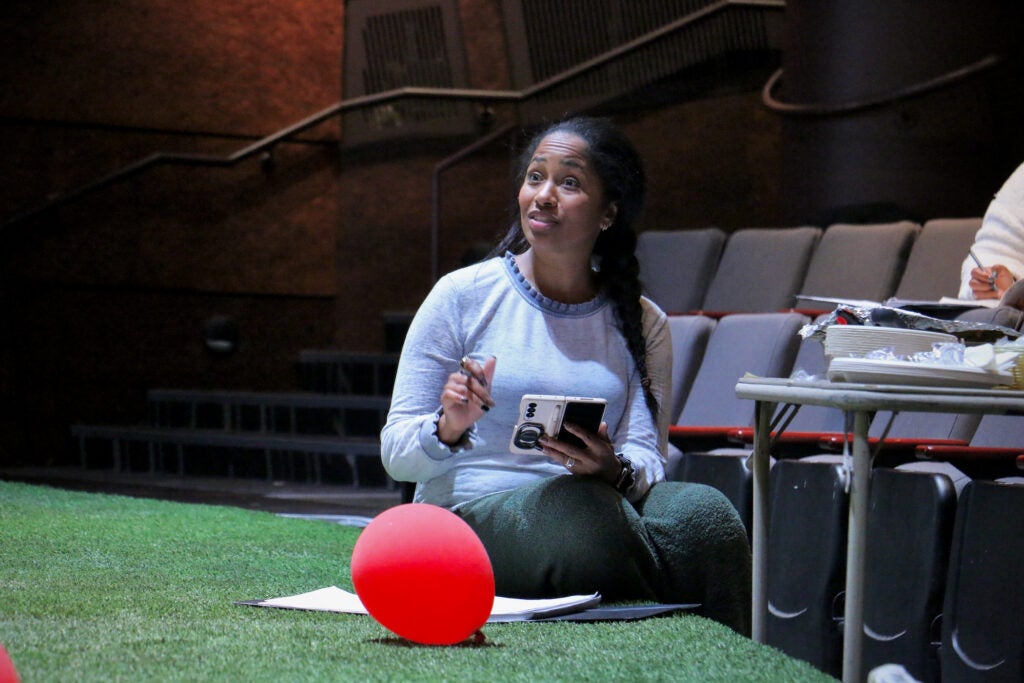 Director Amina Robinson leads a rehearsal