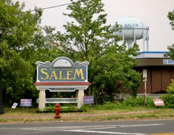 A sign near a road reads Welcome to historic Salem