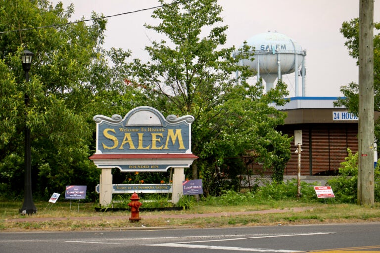 A sign near a road reads Welcome to historic Salem