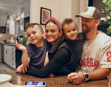 The Huber family (from left), Cash, Jena Stone, and Phil, and big sister Ava (not pictured) at home in Wilmington. (Emma Lee/WHYY)