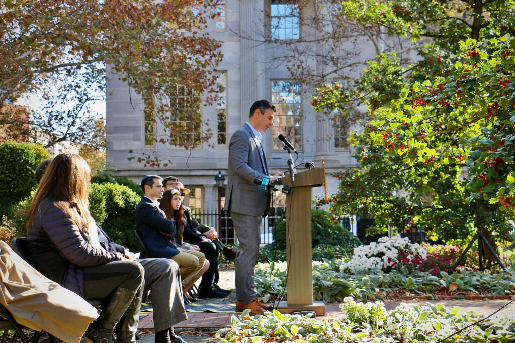 Jonathan Burton speaks at a podium