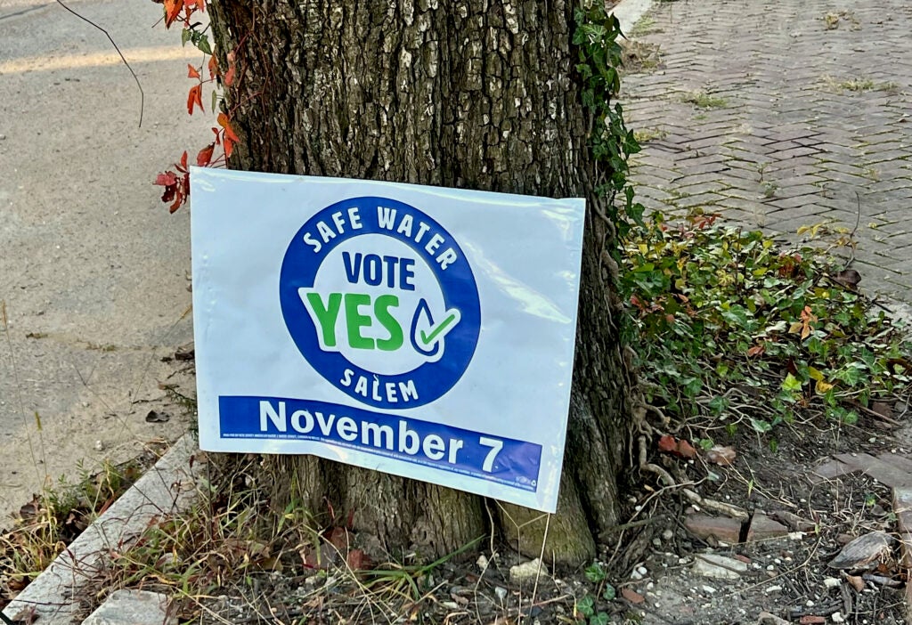 A sign reads Safe Water Vote Yes Salem November 7.