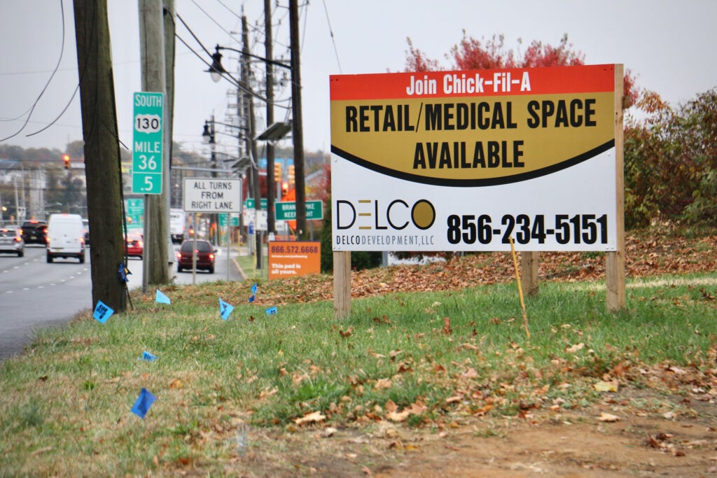 a sign showing retail space available.