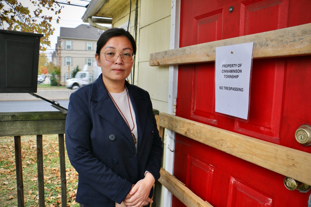 Thao Le stands outside one of her buildings