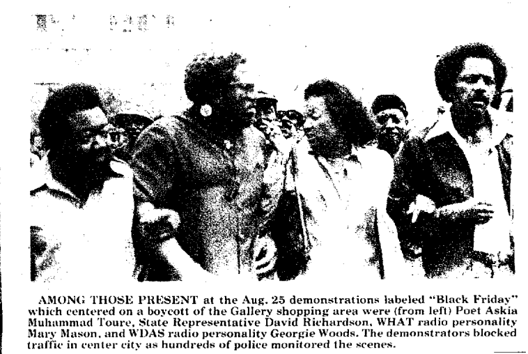 A black-and-white photo shows (from left) Poet Askia Muhummad Toure. State Representative David Richardson, WHAT radio personality Mary Mason, and WHAS radio personality Georgie Woods at a protest