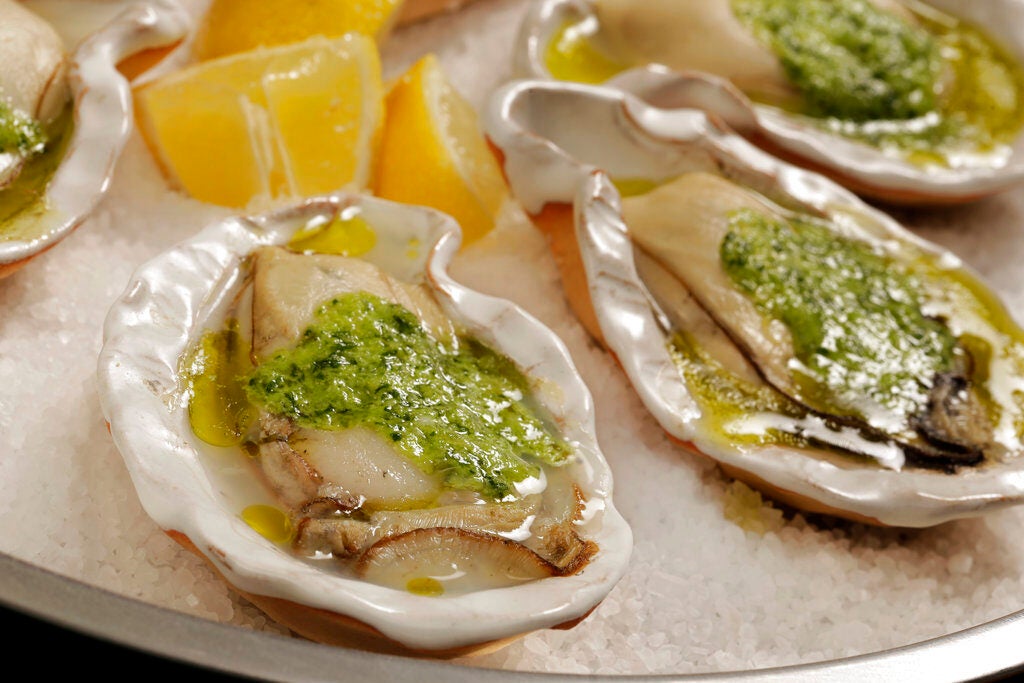 A close-up of grilled oysters