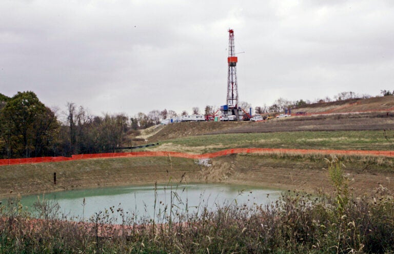 In this Oct. 29, 2008, file photo, a drilling rig used to extract natural gas from the Marcellus Shale, located on a hill above a pond on John Dunn's farm in the Washington County borough of Houston, Pa.