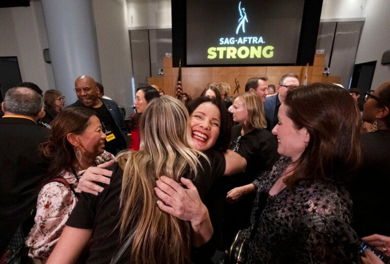 SAG-AFTRA President Fran Drescher, hugs a member of the TV/Theatrical Negotiating Committee member