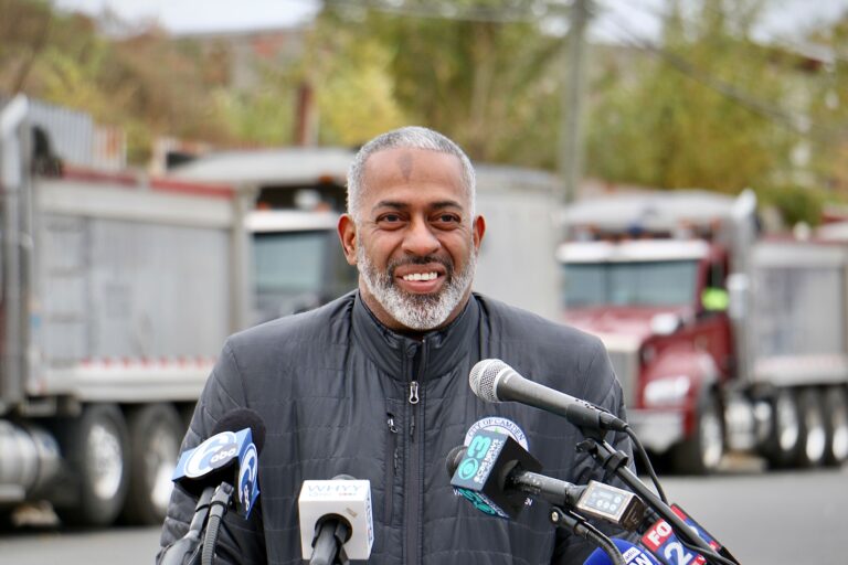 Camden Mayor Vic Carstarphen grins after announcing the final phase of the removal of the mound of dirt and debris illegally dumped at 7th and Chestnut streets.