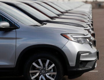 A long line of unsold 2019 Pilot SUVs sits at a Honda BMW dealership in Highlands Ranch, Colo. on Nov. 28, 2018.