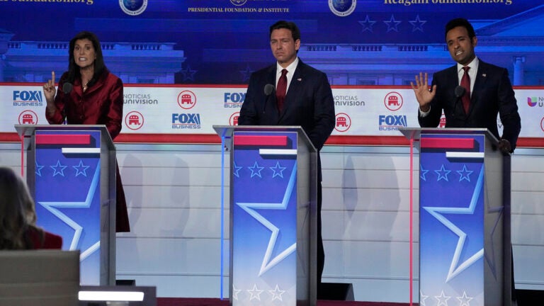 In this photo from the second GOP primary debate on Sept. 27, former U.N. Ambassador Nikki Haley, left, argues a point with businessman Vivek Ramaswamy, right, with Florida Gov. Ron DeSantis at center. (Mark J. Terrill/AP)