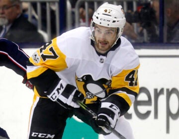 Former Pittsburgh Penguins forward Adam Johnson in action during an NHL game in Columbus, Ohio, in 2017. Police in England arrested a man Tuesday on suspicion of manslaughter in connection to Johnson's death in October.