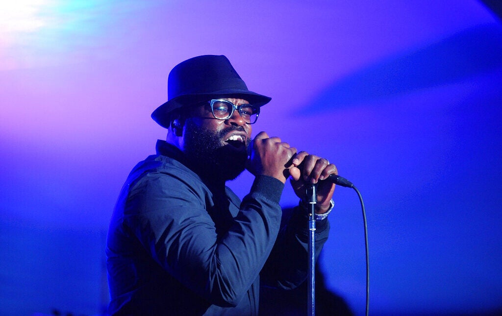 Singer Black Thought sings into the microphone