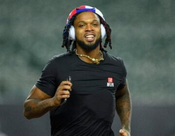 The Buffalo Bills' Damar Hamlin took 10 Cincinnati medical workers out for dinner — and told them he's setting up scholarships in their names. He's seen here before the Bills' game against the Cincinnati Bengals.