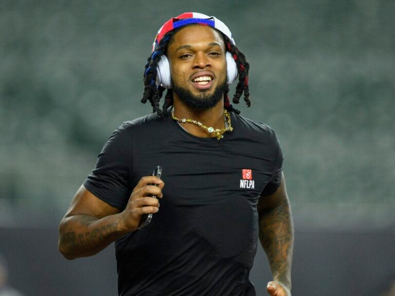 The Buffalo Bills' Damar Hamlin took 10 Cincinnati medical workers out for dinner — and told them he's setting up scholarships in their names. He's seen here before the Bills' game against the Cincinnati Bengals.