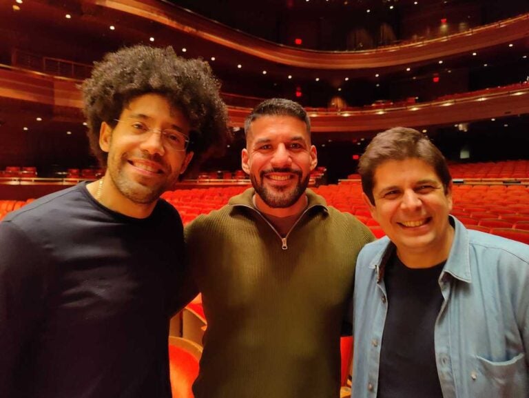 Jimmy López Bellido, center, with conductor Raphael Payare, left, and pianist Javier Perianes, right.