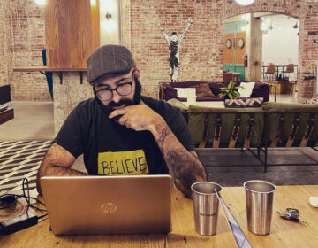 YA author and literary agent Eric Smith writing at a former Philadelphia WeWork location.