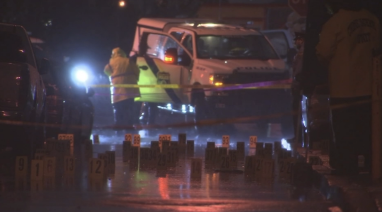 Evidence markers are seen at the scene of a mass shooting