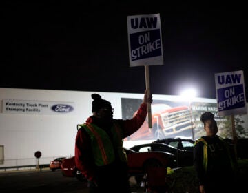 Workers form a picket line outside the Ford Motor Co. Kentucky Truck Plant in the early morning hours on October 12, 2023 in Louisville, Kentucky. This week, a majority of workers at the plant voted no on the tentative contract deal.