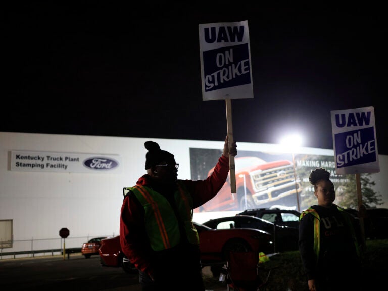 Workers form a picket line outside the Ford Motor Co. Kentucky Truck Plant in the early morning hours on October 12, 2023 in Louisville, Kentucky. This week, a majority of workers at the plant voted no on the tentative contract deal.