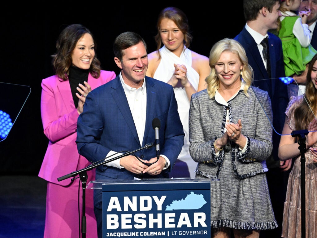 Andy Beshear giving victory speech onstage