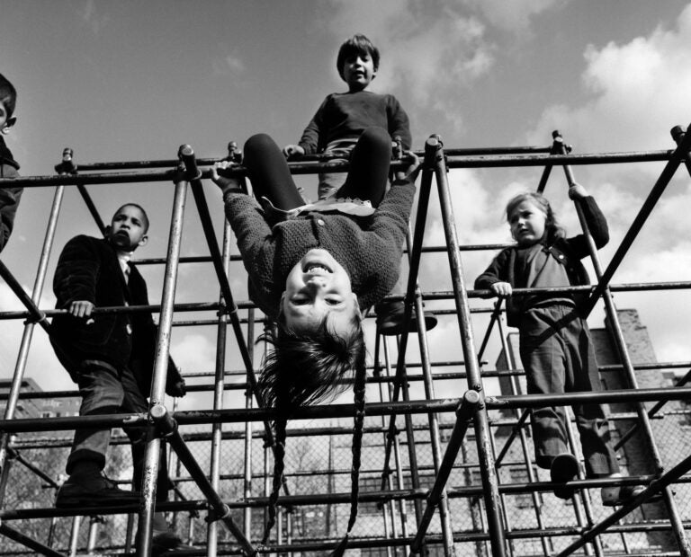 Children playing on a jungle gym.