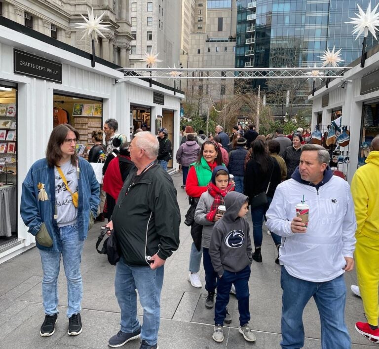 Shoppers enjoy the holiday market in Philadelphia.