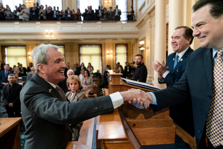 New Jersey Gov. Phil Murphy meets with Senate President Nicholas Scutari, right, and Assembly Speaker Craig Coughlin, second right, before he delivers his State of the State address to a joint session of the Legislature at the statehouse, in Trenton, N.J., Tuesday, Jan. 10, 2023.