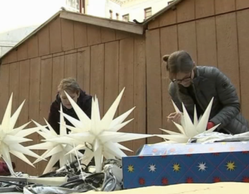 people working on constructing the huts for holiday market