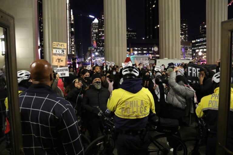 Protesters gathered outside of 30th Street Station along with police